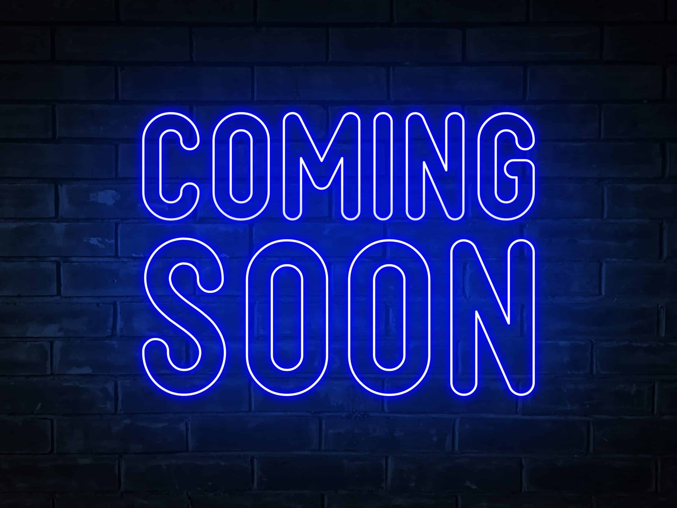 coming-soon-blue-neon-light-word-on-brick-wall-b-2022-11-01-07-04-21-utc